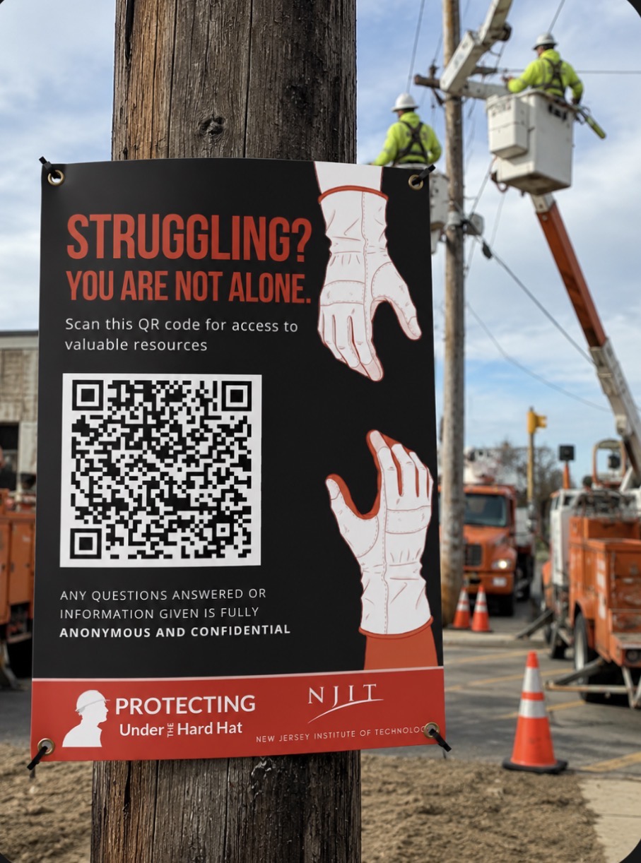 Large vinyl banner on a chain-link jobsite fence